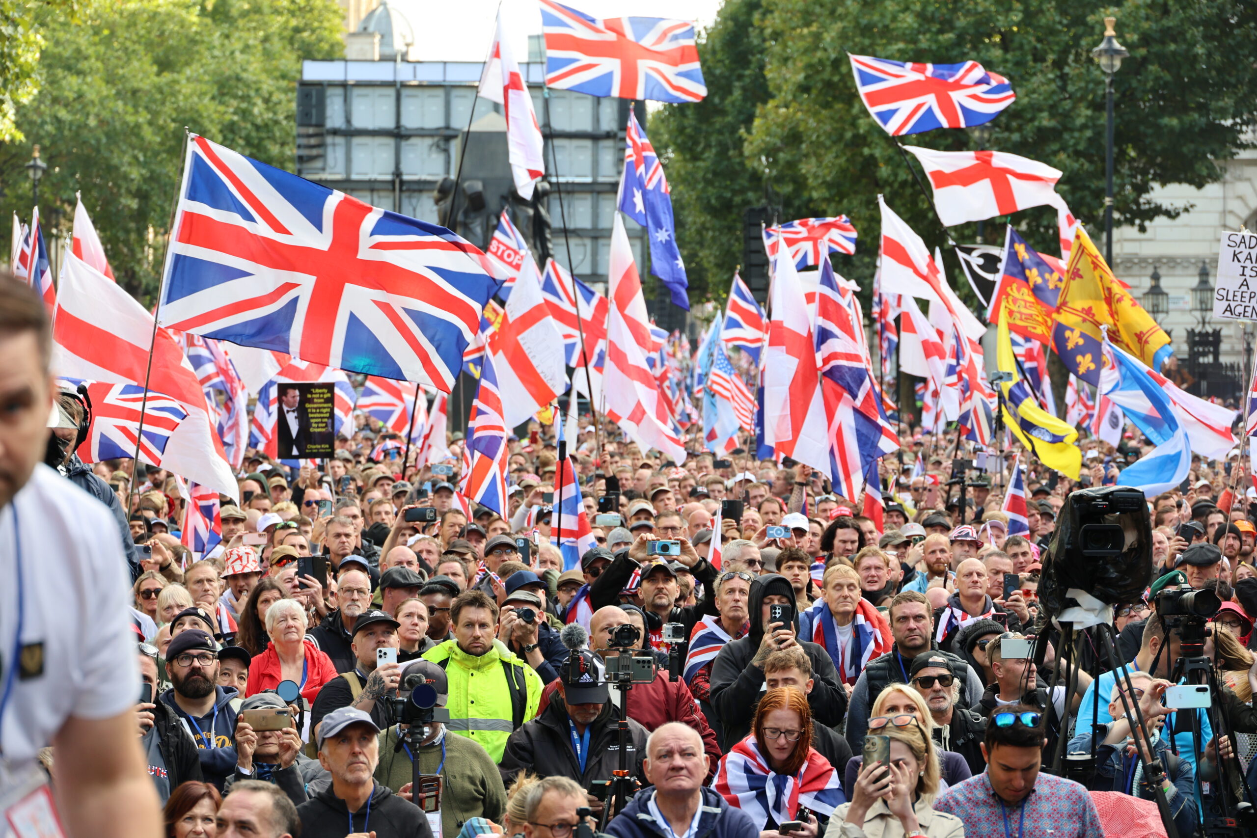 Crowd at a UTK event with UK and England flags